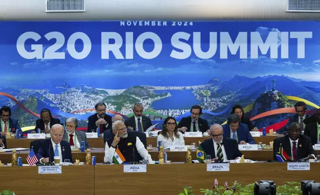 President Joe Biden, from front left, Indian's Prime Minister Narendra Modi, Brazil's President Luis Inacio Lula da Silva, South Africa's President Cyril Ramaphosa and other G20 leaders listen during the G20 Summit at the Museum of Modern Art in Rio de Janeiro, Monday, Nov. 18, 2024. (Eric Lee/The New York Times via AP, Pool)