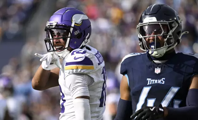 Minnesota Vikings wide receiver Justin Jefferson (18) celebrates in front of Tennessee Titans safety Mike Brown (44) after catching a pass for a first down during the first half of an NFL football game, Sunday, Nov. 17, 2024, in Nashville, Tenn. (AP Photo/John Amis)