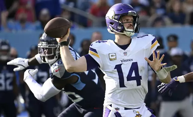 Minnesota Vikings quarterback Sam Darnold (14) throws a pass during the second half of an NFL football game against the Tennessee Titans, Sunday, Nov. 17, 2024, in Nashville, Tenn. (AP Photo/John Amis)