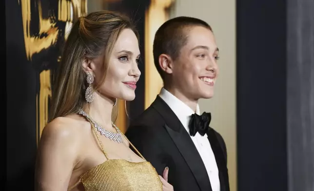 Angelina Jolie, left, and Knox Leon Jolie-Pitt arrive at the 15th Governors Awards on Sunday, Nov. 17, 2024, at The Ray Dolby Ballroom in Los Angeles. (Photo by Jordan Strauss/Invision/AP)