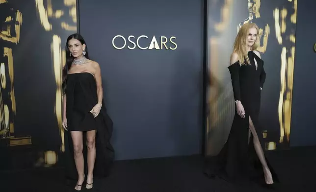 Demi Moore, left, and Nicole Kidman arrive at the 15th Governors Awards on Sunday, Nov. 17, 2024, at The Ray Dolby Ballroom in Los Angeles. (Photo by Jordan Strauss/Invision/AP)