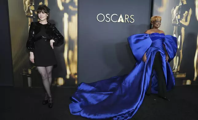 Zooey Deschanel , left, and Aunjanue Ellis-Taylor arrive at the 15th Governors Awards on Sunday, Nov. 17, 2024, at The Ray Dolby Ballroom in Los Angeles. (Photo by Jordan Strauss/Invision/AP)