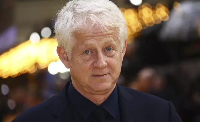 FILE - Filmmaker Richard Curtis appears at the premiere for "Yesterday" in London on June 18, 2019. (Photo by Joel C Ryan/Invision/AP, File)