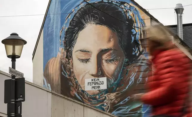 A graffiti, reading "no more feminicide" is sprayed on the wall of a house in Gelsenkirchen, Germany, on the International Day for the Elimination of Violence Against Women, Monday, Nov. 25, 2024. (AP Photo/Martin Meissner)