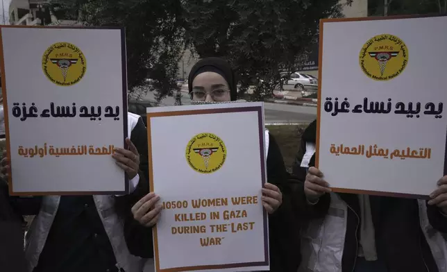 Members of the Palestinian Medical Relief Society mark the International Day for the Elimination of Violence Against Women, in the West Bank city of Bethlehem, Monday, Nov. 25, 2024. (AP Photo/Mahmoud Illean)