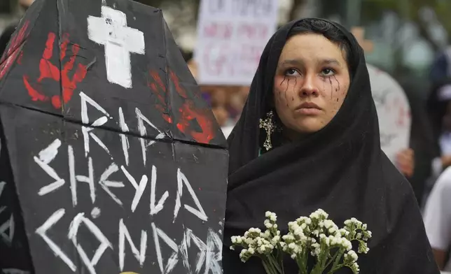 Ariana Campos takes part in a march marking the upcoming International Day for the Elimination of Violence Against Women, in Lima, Peru, Saturday, Nov. 23, 2024. (AP Photo/Guadalupe Pardo)