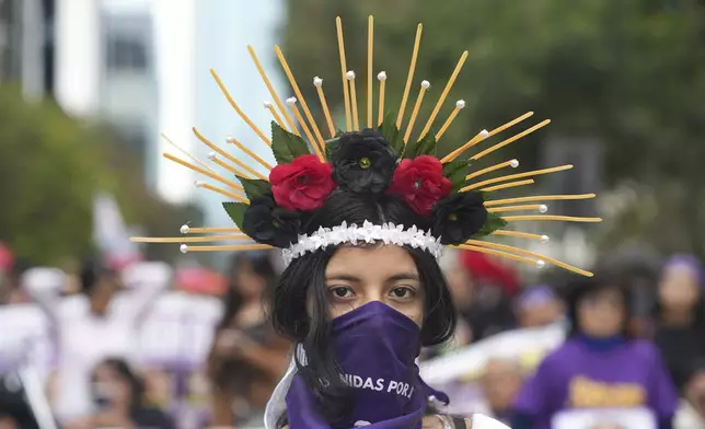 Marieta Correa takes part in a march marking the upcoming International Day for the Elimination of Violence Against Women, in Lima, Peru, Saturday, Nov. 23, 2024. (AP Photo/Guadalupe Pardo)