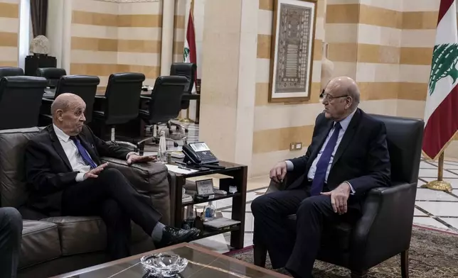 French special envoy to Lebanon Jean-Yves Le Drian, left, meets with Lebanese caretaker Prime Minister Najib Mikati, in Beirut, Lebanon, Thursday, Nov. 28, 2024. (AP Photo/Bilal Hussein)