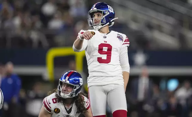 New York Giants place kicker Graham Gano (9) kicks a field goal against the Dallas Cowboys during the second half of an NFL football game in Arlington, Texas, Thursday, Nov. 28, 2024. (AP Photo/Tony Gutierrez)