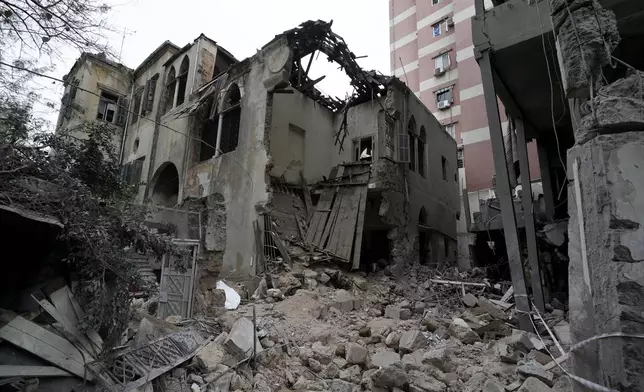 A destroyed building hit on Monday evening by an Israeli airstrike is seen in central Beirut, Lebanon, Tuesday, Nov. 19, 2024. (AP Photo/Bilal Hussein)