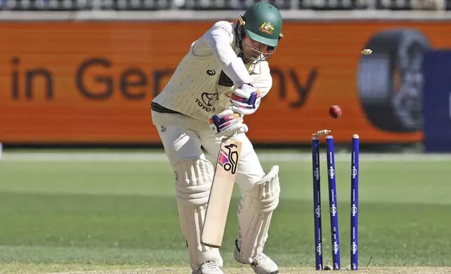 Australia's Alex Carey is bowled out by India's Harshit Rana on the fourth day of the first cricket test between Australia and India in Perth, Australia, Monday, Nov. 25, 2024. (AP Photo/Trevor Collens)