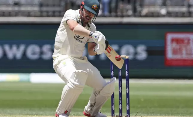 Australia's Travis Head bats on the fourth day of the first cricket test between Australia and India in Perth, Australia, Monday, Nov. 25, 2024. (AP Photo/Trevor Collens)