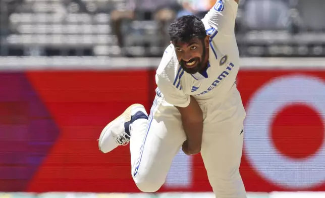 India's captain Jasprit Bumrah bowls a delivery on the fourth day of the first cricket test between Australia and India in Perth, Australia, Monday, Nov. 25, 2024. (AP Photo/Trevor Collens)