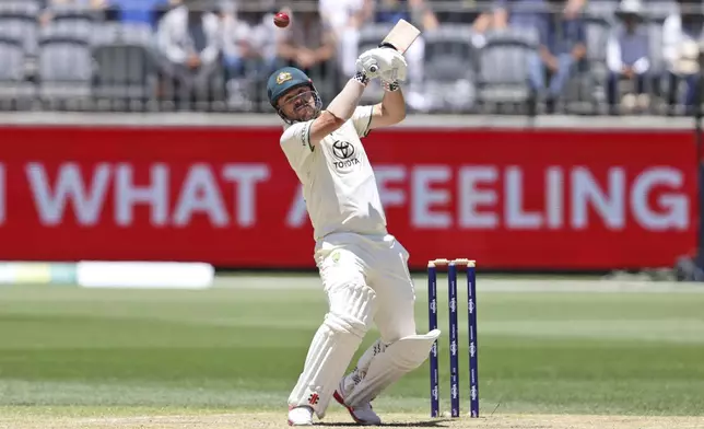 Australia's Travis Head bats on the fourth day of the first cricket test between Australia and India in Perth, Australia, Monday, Nov. 25, 2024. (AP Photo/Trevor Collens)