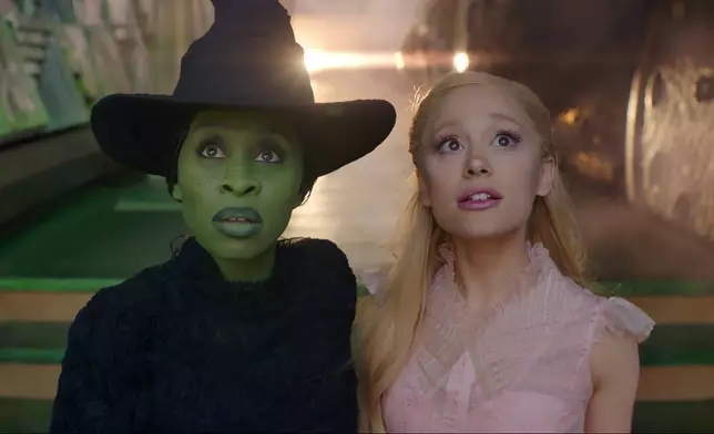 This image released by Universal Pictures shows Cynthia Erivo, left, and Ariana Grande in a scene from the film "Wicked." (Universal Pictures via AP)