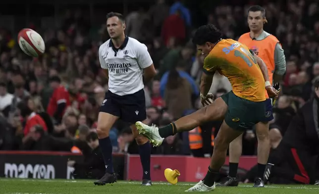 Australia's Noah Lolesio kicks a penalty during the Autumn Nations series rugby union match between Wales and Australia at the Principality Stadium in Cardiff, Wales, Sunday, Nov. 17, 2024.(AP Photo/Rui Vieira)