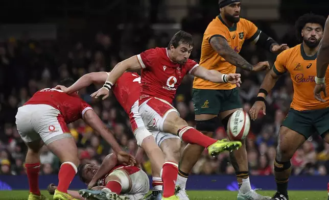 Wales' Rhodi Williams kicks the ball to clear during the Autumn Nations series rugby union match between Wales and Australia at the Principality Stadium in Cardiff, Wales, Sunday, Nov. 17, 2024.(AP Photo/Rui Vieira)