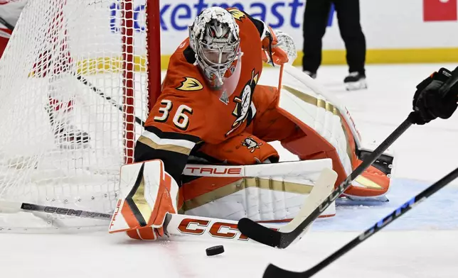 Anaheim Ducks goaltender John Gibson (36) deflects a shot against the Detroit Red Wings during the second period of an NHL hockey game in Anaheim, Calif., Friday, Nov. 15, 2024. (AP Photo/Alex Gallardo)