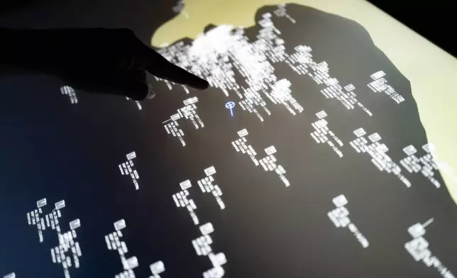 An Interactive nautical map shows locations of boats around the Senegalese offshore patrol vessel Niani during a mission to search for migrant boats near the coast of Dakar, Senegal, Saturday, Nov.16, 2024. (AP Photo/Sylvain Cherkaoui)