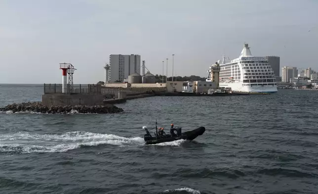 Senegalese sailors in their zodiac return to port following a mission to search for migrant boats near the coast of Dakar, Senegal, Saturday, Nov.16, 2024. (AP Photo/Sylvain Cherkaoui)