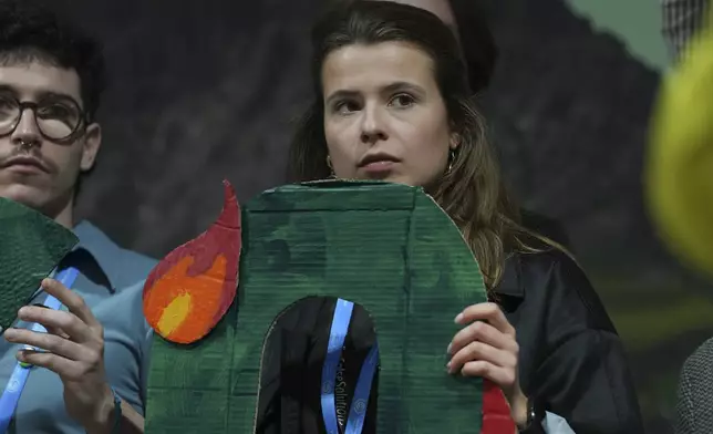 Activist Luisa Neubauer, of Germany, participates in a demonstration against fossil fuels at the COP29 U.N. Climate Summit, Friday, Nov. 15, 2024, in Baku, Azerbaijan. (AP Photo/Peter Dejong)