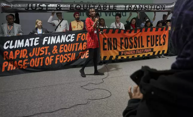 Eric Njuguna, of Kenya, participates in a demonstration against fossil fuels at the COP29 U.N. Climate Summit, Friday, Nov. 15, 2024, in Baku, Azerbaijan. (AP Photo/Peter Dejong)