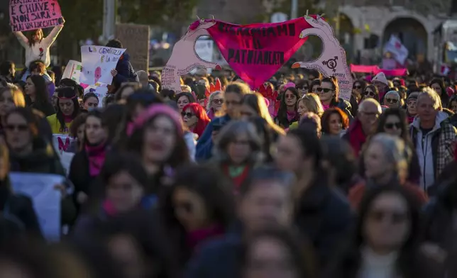 Demonstrators take part in a rally ahead of the International Day for the Elimination of Violence against Women which will be held on Nov. 25, in Rome, Saturday, Nov. 23, 2024. (AP Photo/Andrew Medichini)