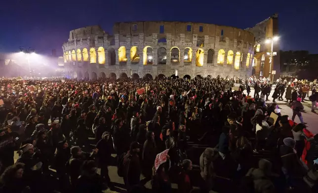 People take part in a rally ahead of the International Day for the Elimination of Violence against Women, in front of the Colosseum in Rome, Saturday, Nov. 23, 2024.. (Roberto Monaldo/LaPresse via AP)