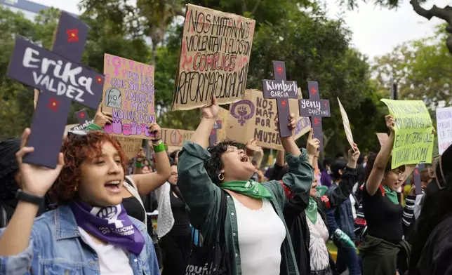 People take part in a march marking the upcoming International Day for the Elimination of Violence Against Women, in Lima, Peru, Saturday, Nov. 23, 2024. (AP Photo/Guadalupe Pardo)