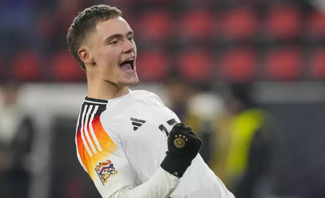 Germany's Florian Wirtz celebrates after scoring his side's fourth goal during the Nations League group soccer match between Germany and Bosnia in Freiburg, Germany, Saturday, Nov. 16, 2024. (AP Photo/Michael Probst)