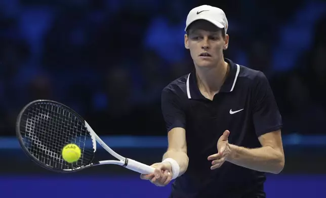 Italy's Jannik Sinner returns the ball to United States' Taylor Fritz during their singles tennis match of the ATP World Tour Finals at the Inalpi Arena, in Turin, Italy, Tuesday, Nov. 12, 2024. (AP Photo/Antonio Calanni)