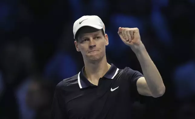 Italy's Jannik Sinner celebrates after winning the singles tennis match of the ATP World Tour Finals against United States' Taylor Fritz, at the Inalpi Arena, in Turin, Italy, Tuesday, Nov. 12, 2024. (AP Photo/Antonio Calanni)