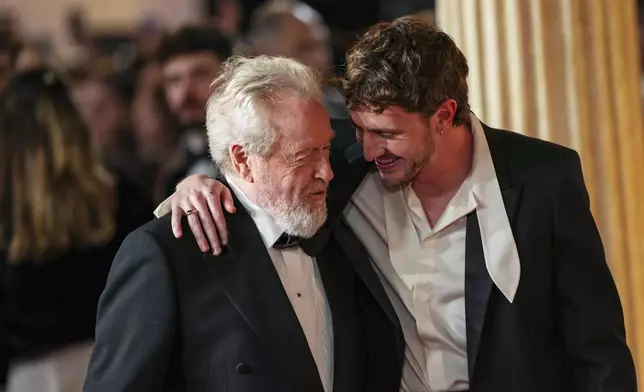 Director Ridley Scott, left, and Paul Mescal pose for photographers upon arrival at the premiere of the film 'Gladiator II' on Wednesday, Nov. 13, 2024, in London. (Photo by Scott A Garfitt/Invision/AP)