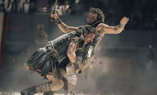 This image released by Paramount Pictures shows Pedro Pascal, left, and Paul Mescal in a scene from "Gladiator II." (Aidan Monaghan/Paramount Pictures via AP)