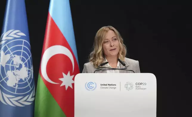 Italy Prime Minister Giorgia Meloni speaks during a plenary session at the COP29 U.N. Climate Summit, Wednesday, Nov. 13, 2024, in Baku, Azerbaijan. (AP Photo/Sergei Grits)