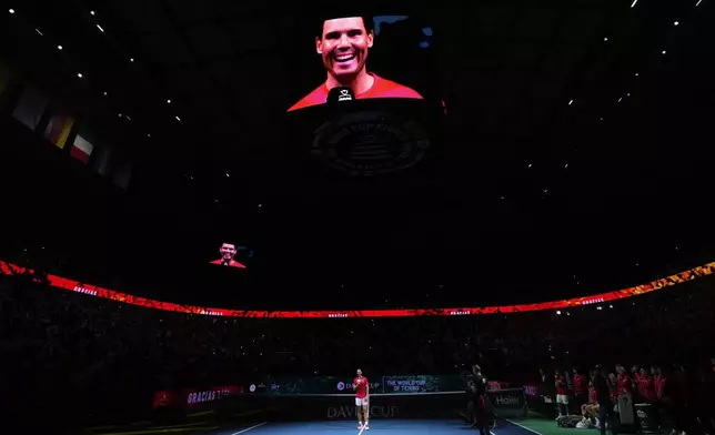 Spain's Rafael Nadal talks to the crowd during a tribute after playing his last match as a professional tennis player in the Davis Cup quarterfinals at the Martin Carpena Sports Hall in Malaga, southern Spain, on early Wednesday, Nov. 20, 2024. (AP Photo/Manu Fernandez)