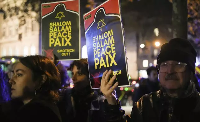 Protestors take part in a rally against the "Israel is Forever" gala organized by far-right Franco-Israeli figures, in Paris, Wednesday, Nov. 13, 2024, on the eve of the UEFA Nations League 2025 soccer match between France and Israel. (AP Photo/Christophe Ena)