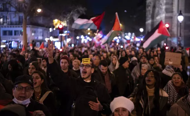 Protestors take part in a rally against the "Israel is Forever" gala organized by far-right Franco-Israeli figures, in Paris, Wednesday, Nov. 13, 2024, on the eve of the UEFA Nations League 2025 soccer match between France and Israel. (AP Photo/Louise Delmotte)