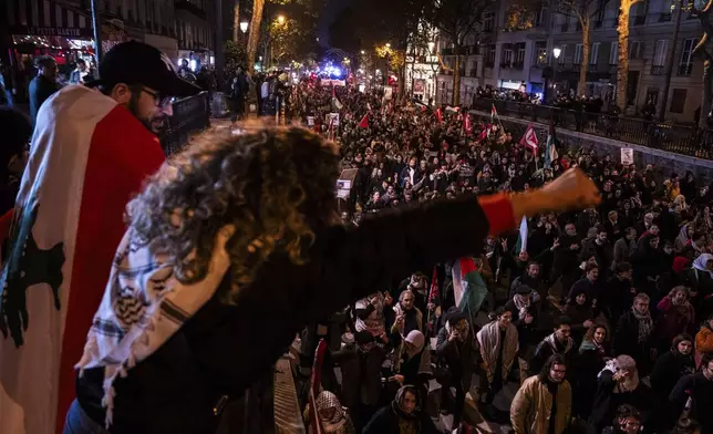 Protesters take part in a rally against the "Israel is Forever" gala organized by far-right Franco-Israeli figures, in Paris, Wednesday, Nov. 13, 2024, on the eve of the Nations League 2025 soccer match between France and Israel. (AP Photo/Louise Delmotte)