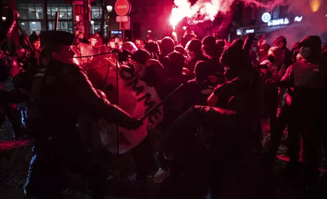 Protesters and police clash during a rally against the "Israel is Forever" gala organized by far-right Franco-Israeli figures, in Paris, Wednesday, Nov. 13, 2024, on the eve of the UEFA Nations League 2025 soccer match between France and Israel. (AP Photo/Louise Delmotte)