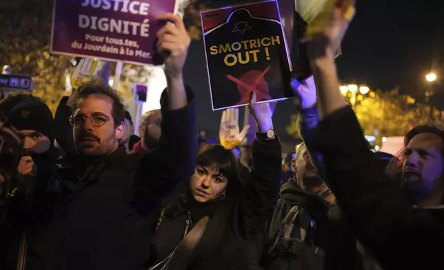 Protesters take part in a rally against the "Israel is Forever" gala organized by far-right Franco-Israeli figures, in Paris, Wednesday, Nov. 13, 2024, on the eve of the UEFA Nations League 2025 soccer match between France and Israel. (AP Photo/Christophe Ena)