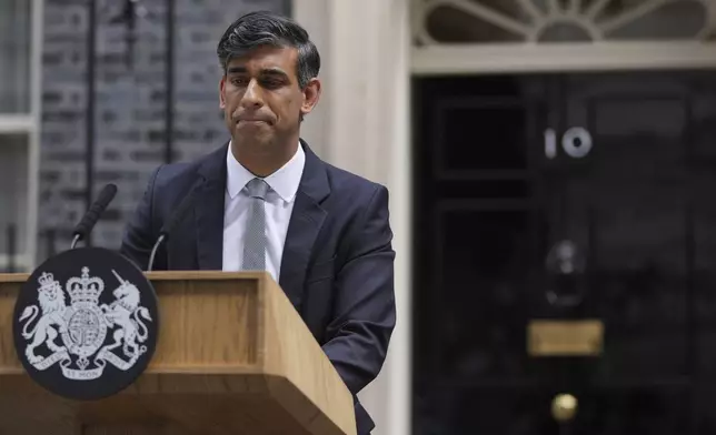 FILE - Britain's outgoing Conservative Party Prime Minister Rishi Sunak looks down as he makes a short speech outside 10 Downing Street before going to see King Charles III to tender his resignation in London, Friday, July 5, 2024. (AP Photo/Kin Cheung, file)