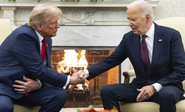 FILE - President Joe Biden meets with President-elect Donald Trump in the Oval Office of the White House, Wednesday, Nov. 13, 2024, in Washington. (AP Photo/Evan Vucci, file)