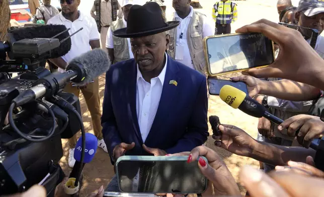 FILE - President Mokgweetsi Masisi of Botswana speaks to journalists after casting his vote during the elections at Mosielele primary school in Moshupa village, Southern District, Wednesday, Oct. 30, 2024. (AP Photo/Themba Hadebe, file)