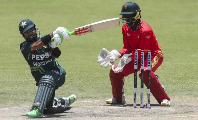 Pakistan's Mohammad Rizwan plays a shot during the third ODI cricket match between Zimbabwe and Pakistan at Queens Sports Club in Bulawayo, Zimbabwe, Thursday, Nov. 28, 2024. (AP Photo/Wonder Mashura)