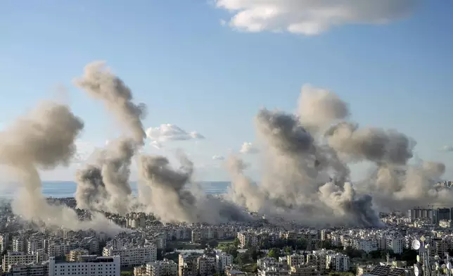 Smoke rises following an Israeli airstrike on Dahiyeh, in Beirut, Lebanon, Tuesday, Nov. 26, 2024. (AP Photo/Bilal Hussein)