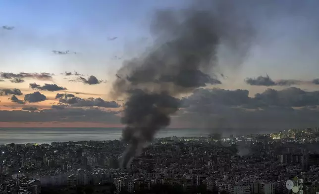 Smoke rises following an Israeli airstrike on Dahiyeh, in Beirut, Lebanon, Tuesday, Nov. 26, 2024. (AP Photo/Bilal Hussein)