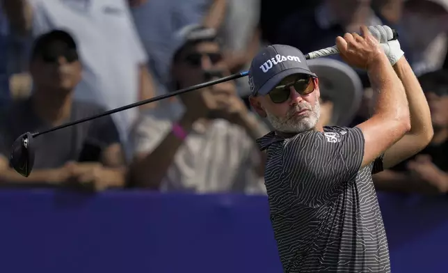 Paul Waring of England hits off the first tee during the first round of World Tour Golf Championship in Dubai, United Arab Emirates, Thursday, Nov. 14, 2024. (AP Photo/Altaf Qadri)