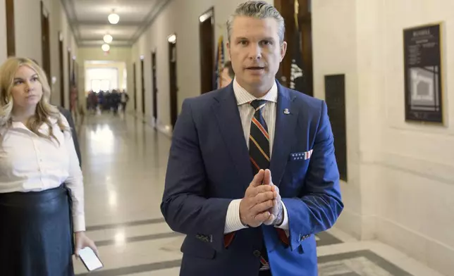 Pete Hegseth, President-elect Donald Trump's pick for secretary of defense, speaks with reporters following a meeting with senators on Capitol Hill, Thursday, Nov. 21, 2024, in Washington. (AP Photo/Rod Lamkey, Jr.)