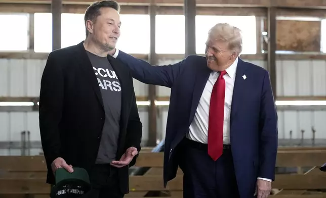 FILE - Tesla and SpaceX CEO Elon Musk, left, and Republican presidential nominee former President Donald Trump attend a campaign event at the Butler Farm Show on Oct. 5, 2024, in Butler, Pa. (AP Photo/Alex Brandon, File)